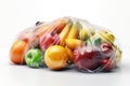Fruits and vegetables in a plastic bags on white background,