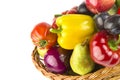 Fruits and vegetables in a wicker basket isolated on a white. Free space for text Royalty Free Stock Photo