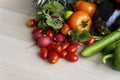 Fruits and vegetables on a wooden table. Organic vegetables variety in wood board