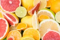 Fruits with vitamin C are finely chopped and lie as a background, apilxine and lemons