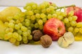 Fruits on white. Apples, pears and grapes. Close-up. Beautifully laid out fruits on a  table. Royalty Free Stock Photo