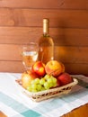 Fruits, wineglass and bottle with wine on a table Royalty Free Stock Photo