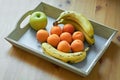 Fruits in a wooden box. peaches. banana. green apple. Top view. Tropical fruit diet. Vegan food Royalty Free Stock Photo