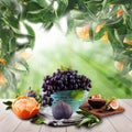 Fruits on wooden table garden. Natural tangerines in green sunlight morning background Royalty Free Stock Photo