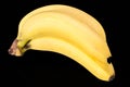 Fruits of yellow bannan on black background, close up Royalty Free Stock Photo