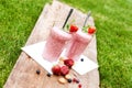 Fruity berry milkshake outdoors