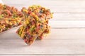 Fruity Cereal Marshmallow Treat Bars on a Wood Table