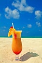 Fruity cocktail is on a beach Royalty Free Stock Photo