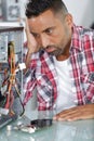 frustated man next to broken pc Royalty Free Stock Photo