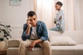 frustraited african american couple sitting on couch and thinking Royalty Free Stock Photo