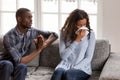 Frustrated African American man apologizing to woman after quarr Royalty Free Stock Photo