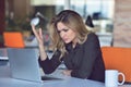 Frustrated angry woman screaming on her laptop. Royalty Free Stock Photo