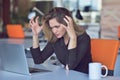 Frustrated angry woman screaming on her laptop. Royalty Free Stock Photo