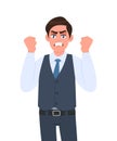 Frustrated, angry young businessman raised his hand fists shout/screaming. Crazy, negative, bad facial expressions. Male character