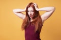 Frustrated angry woman holding her head screaming Royalty Free Stock Photo