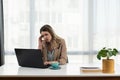 Frustrated annoyed woman confused by computer problem, annoyed businesswoman feels indignant about laptop crash, bad news online Royalty Free Stock Photo