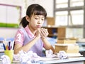 Frustrated asian elementary school girl Royalty Free Stock Photo