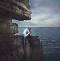 Frustrated businessman on the cliff Royalty Free Stock Photo