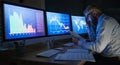 Frustrated businessman with computer sitting at desk, working late. Financial crisis concept. Royalty Free Stock Photo