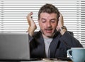 Frustrated businessman desperate at office computer desk holding notepad with the hashtag me too metoo as exploited employee Royalty Free Stock Photo