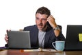 Frustrated businessman desperate at office computer desk holding notepad with the hashtag me too metoo as exploited employee Royalty Free Stock Photo