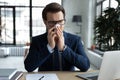 Frustrated businessman, office employee, manager blowing running nose Royalty Free Stock Photo