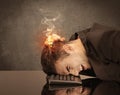 Sad business person`s head catching fire Royalty Free Stock Photo