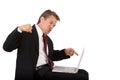 Frustrated computer user punches laptop Royalty Free Stock Photo