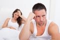 Frustrated couple on bed Royalty Free Stock Photo
