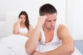 Frustrated couple on bed Royalty Free Stock Photo