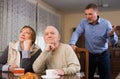 Frustrated elderly woman and man with screaming son Royalty Free Stock Photo