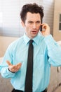 Frustrated executive on cell phone Royalty Free Stock Photo