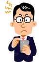 Frustrated expression of a businessman wearing glasses operating a smartphone