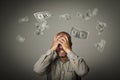Frustrated. Falling dollars. Royalty Free Stock Photo
