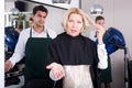 Frustrated female pensioner having fight with hairdresser Royalty Free Stock Photo