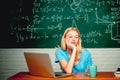 Frustrated female student sitting at the desk in university. Knowledge day. Back to school. Home schooling. Desperate