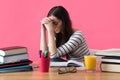 Frustrated female student sitting at her desk.