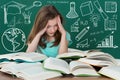 Frustrated Girl Looking At Many Books On Desk