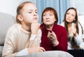 Frustrated girl while mother and grandmother berating her Royalty Free Stock Photo