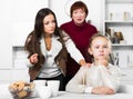 Frustrated girl while mother and grandmother berating her Royalty Free Stock Photo