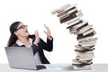 Frustrated Indian worker with falling books Royalty Free Stock Photo