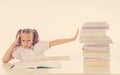 Frustrated little schoolgirl feeling a failure unable to concentrate in reading and writing difficulties learning problem