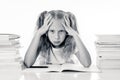 Frustrated little schoolgirl feeling a failure unable to concentrate in reading and writing difficulties learning problem Royalty Free Stock Photo