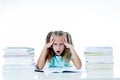 Frustrated little schoolgirl feeling a failure unable to concentrate in reading and writing difficulties learning problem Royalty Free Stock Photo