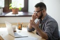 Frustrated male employee discussing contract details over the ph Royalty Free Stock Photo