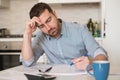 Frustrated man calculating bills expenses Royalty Free Stock Photo