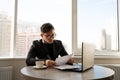 Frustrated man calculating bills and tax expenses, businessman wearing glasses bankruptcy office, financial crisis Royalty Free Stock Photo