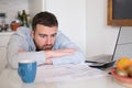 Frustrated man calculating bills and tax expenses Royalty Free Stock Photo