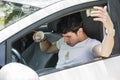 Frustrated Man in Car with Spilled Coffee on Shirt