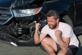 frustrated man driver at broken car after automobile collision car accident, car insurance Royalty Free Stock Photo